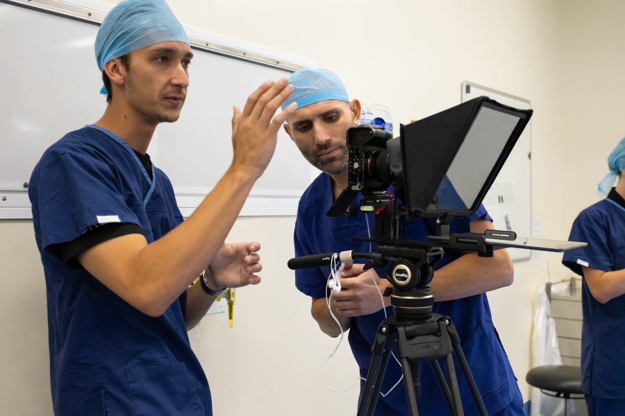 Filming a medical explainer in theatre scrubs